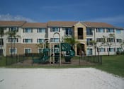 Thumbnail 2 of 15 - Playground near building at Hawk's Landing Apartments, Fort Myers