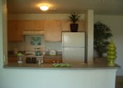 Thumbnail 11 of 15 - Kitchen with appliances at Hawk's Landing Apartments, Fort Myers, Florida