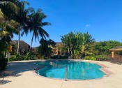 Thumbnail 5 of 19 - exterior and pool at Indian Trace, West Palm Beach, 33407