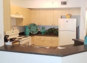 Thumbnail 11 of 19 - kitchen area with white appliances at Indian Trace, Florida , 33407