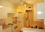 Thumbnail 12 of 14 - Marbrisa Apartments kitchen with white appliances and lots of cabinetry at Marbrisa Apartments, Florida