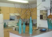 Thumbnail 9 of 13 - kitchen space with white appliances and blonde colored cabinetry at Mariners Cove, Tampa, Florida