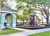 Thumbnail 7 of 14 - Mirabella Apartments community exterior with sidewalks and playground at Mirabella Apartments, Princeton, FL, 33032