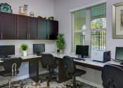 Thumbnail 8 of 14 - Mirabella Apartments business center with computers for resident use at Mirabella Apartments, Florida