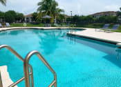 Thumbnail 5 of 27 - Tuscany Place resort style pool and lounge chairs at Tuscany Place Apartments, Homestead , FL 33032