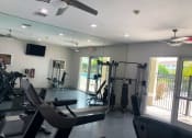 Thumbnail 8 of 27 - fitness center with cardio and weight equipmen at Tuscany Place Apartments, Homestead , 33032