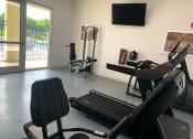 Thumbnail 9 of 27 - Tuscany Place fitness center with cardio and weight equipment at Tuscany Place Apartments, Homestead , Florida