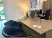 Thumbnail 27 of 27 - Tuscany Place leasing office with desk and chairs at Tuscany Place Apartments, Homestead 