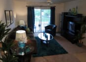 Thumbnail 20 of 27 - living area with ceiling fan and balcony at Tuscany Place Apartments, Florida, 33032