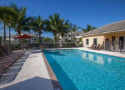 Thumbnail 2 of 9 - resort style pool and lounge chairs at Valencia Pointe, Florida