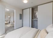 Thumbnail 9 of 27 - a bedroom with a large bed and a closet