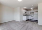 Thumbnail 11 of 27 - a white kitchen with white appliances and white cabinets