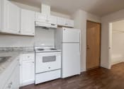 Thumbnail 12 of 27 - a kitchen with white appliances and white cabinets