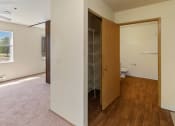 Thumbnail 17 of 27 - an empty room with a closet and a toilet in it