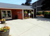 Thumbnail 17 of 52 - the front of a building with a sidewalk and potted plants at Fort Vancouver Terrace, Washington, 98661