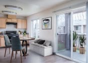 Thumbnail 24 of 52 - a living room and kitchen with a sliding glass door at Fort Vancouver Terrace, Vancouver, WA, 98661