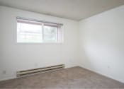 Thumbnail 33 of 52 - an empty room with a window and carpet at Fort Vancouver Terrace, Vancouver, WA, 98661