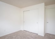 Thumbnail 34 of 52 - a bedroom with two closets and a carpeted floor at Fort Vancouver Terrace, Washington, 98661