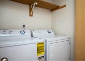 Thumbnail 51 of 52 - two washers and dryers in a room with a closet at Fort Vancouver Terrace, Vancouver
