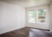 Thumbnail 16 of 50 - an empty room with white walls and a window at Quail Run Apartments, Vancouver