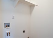 Thumbnail 33 of 50 - a white bathroom with a urinal and a white wall at Quail Run Apartments, Vancouver, WA 98684