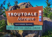 Thumbnail 2 of 46 - a sign for trouble terrace apartment homes on a rock at Troutdale Terrace, Oregon 97060