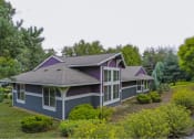 Thumbnail 14 of 46 - a house with a purple roof in a field of trees at Troutdale Terrace, Troutdale, OR 97060