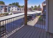 Thumbnail 16 of 46 - a balcony with a view of a pool and a house at Troutdale Terrace, Troutdale,  97060