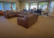 Thumbnail 17 of 46 - a living room with two couches and a dining room table at Troutdale Terrace, Oregon 97060