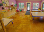 Thumbnail 20 of 46 - a classroom with tables and chairs and a sink at Troutdale Terrace, Troutdale