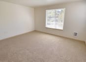 Thumbnail 27 of 46 - an empty room with a window and carpet at Troutdale Terrace, Troutdale, OR 97060