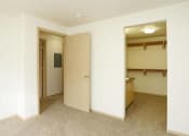 Thumbnail 30 of 46 - an empty room with a bathroom and an open door at Troutdale Terrace, Oregon