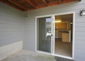 Thumbnail 31 of 46 - a sliding glass door in a room with a kitchen at Troutdale Terrace, Troutdale