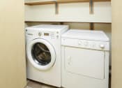 Thumbnail 33 of 46 - a washing machine and a dryer in a closet at Troutdale Terrace, Oregon 97060