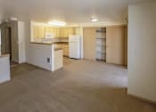 Thumbnail 36 of 46 - an empty room with a counter in the middle of it at Troutdale Terrace, Troutdale, Oregon