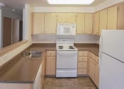 Thumbnail 42 of 46 - a kitchen with washer at Troutdale Terrace, Troutdale, Oregon