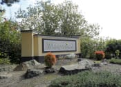 Thumbnail 1 of 49 - a sign for the property in front of some rocks at Whisperwood, Washington