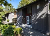 Thumbnail 4 of 49 - the front of a building with a driveway and a door at Whisperwood, Seattle, 98168