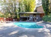Thumbnail 8 of 49 - a swimming pool in front of a house at Whisperwood, Seattle, WA
