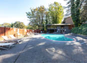Thumbnail 9 of 49 - a backyard with a pool and chairs and a house at Whisperwood, Seattle, WA