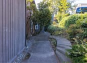 Thumbnail 11 of 49 - a sidewalk in front of a house at Whisperwood, Seattle, WA