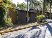 Thumbnail 22 of 49 - a house with a road in front of it at Whisperwood, Seattle, Washington