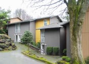 Thumbnail 25 of 49 - the exterior of a house with a driveway and a tree at Whisperwood, Washington 98168