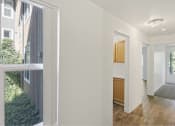Thumbnail 30 of 49 - the view of a living room and a kitchen from a window at Whisperwood, Seattle, Washington
