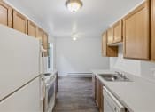 Thumbnail 31 of 49 - a kitchen with white cabinets and a sink and a refrigerator at Whisperwood, Seattle, WA