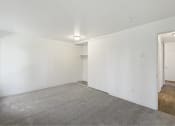 Thumbnail 41 of 49 - a bedroom with white walls and carpet and a closet at Whisperwood, Washington 98168
