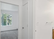 Thumbnail 46 of 49 - a white bathroom with a window and a door at Whisperwood, Washington
