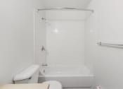 Thumbnail 49 of 49 - a white bathroom with a toilet and a shower at Whisperwood, Seattle, 98168