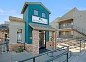 Thumbnail 1 of 63 - A leasing office is located in a building with a green trim at The Henley Apartments, California