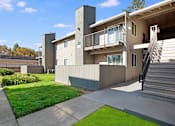 Thumbnail 60 of 63 - A modern house with a balcony and stairs leading to the second floor at The Henley Apartments, Suisun City, California